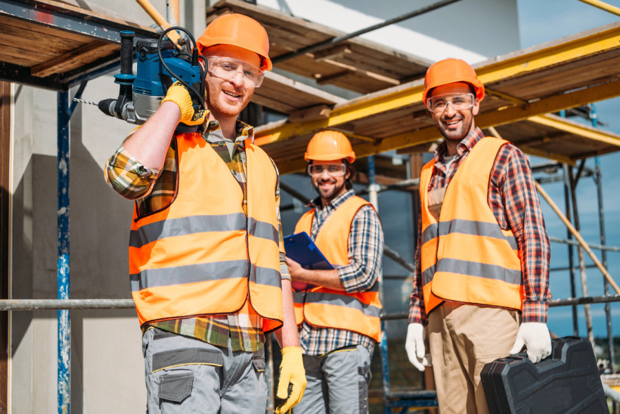builders on house construction site
